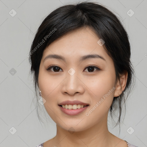 Joyful asian young-adult female with medium  black hair and brown eyes