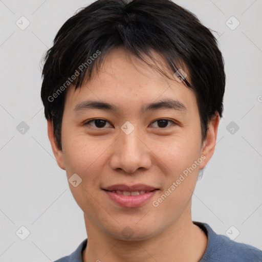 Joyful asian young-adult male with short  black hair and brown eyes