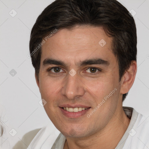 Joyful white young-adult male with short  brown hair and brown eyes