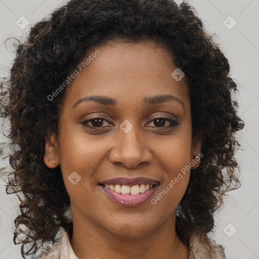 Joyful black young-adult female with long  brown hair and brown eyes