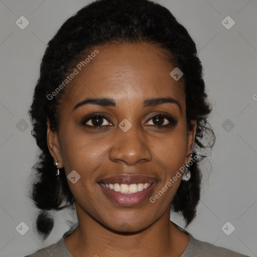 Joyful black young-adult female with medium  black hair and brown eyes