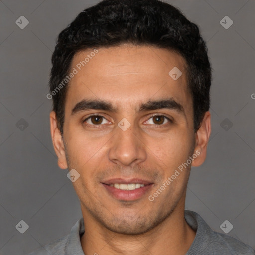 Joyful white young-adult male with short  black hair and brown eyes