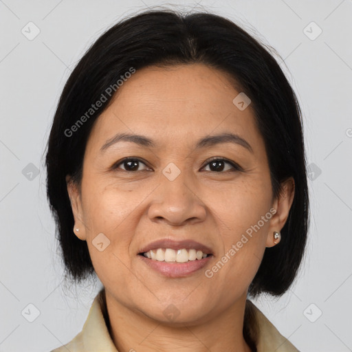 Joyful asian adult female with medium  brown hair and brown eyes