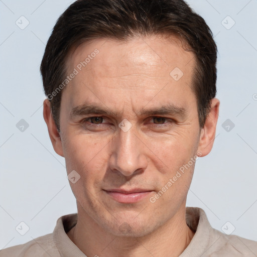 Joyful white adult male with short  brown hair and brown eyes