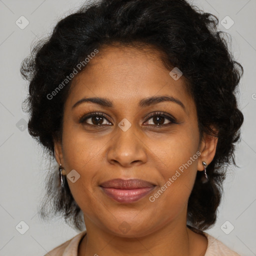 Joyful black adult female with medium  brown hair and brown eyes