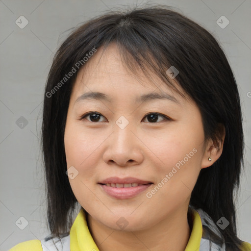 Joyful asian young-adult female with medium  brown hair and brown eyes