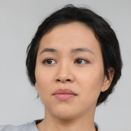 Neutral asian young-adult female with medium  brown hair and brown eyes