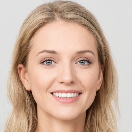 Joyful white young-adult female with long  brown hair and blue eyes