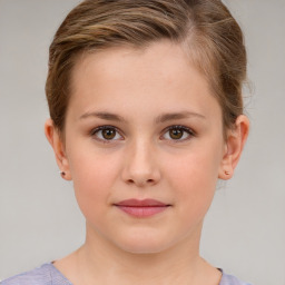 Joyful white child female with short  brown hair and brown eyes