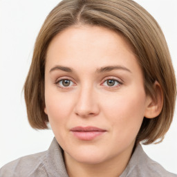 Joyful white young-adult female with medium  brown hair and blue eyes