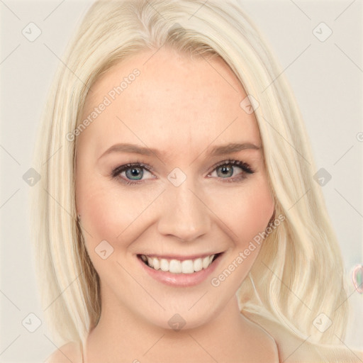 Joyful white young-adult female with long  blond hair and blue eyes