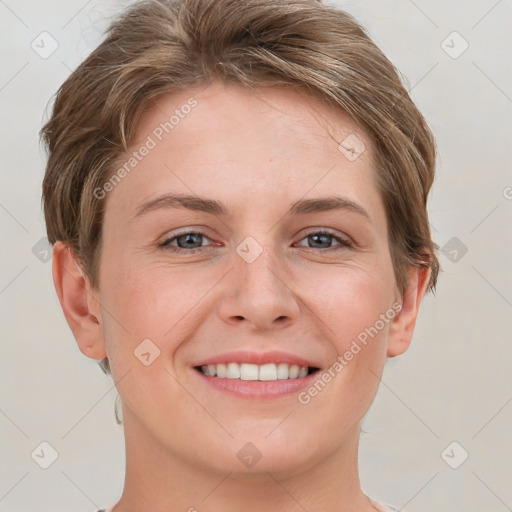 Joyful white young-adult female with short  brown hair and grey eyes