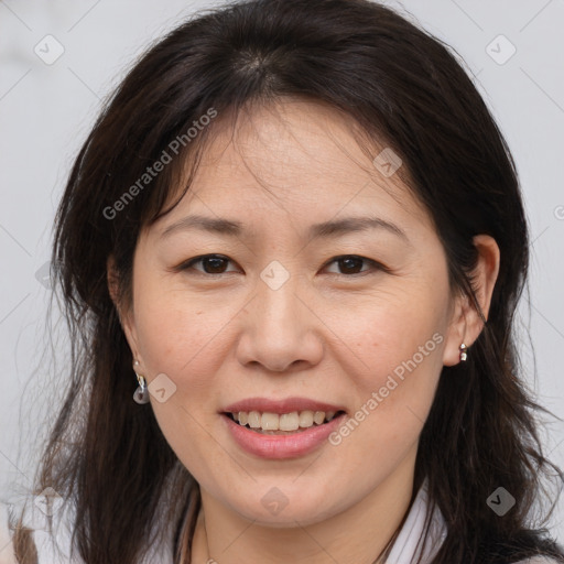 Joyful white adult female with medium  brown hair and brown eyes