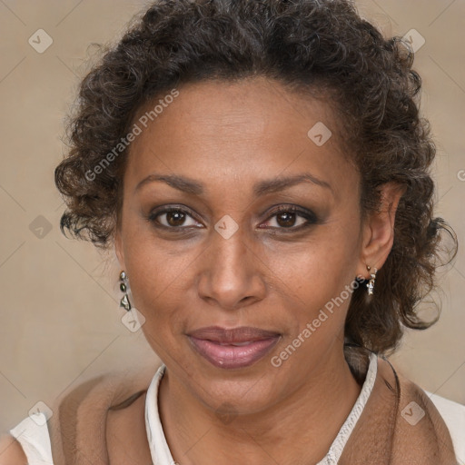 Joyful black adult female with short  brown hair and brown eyes