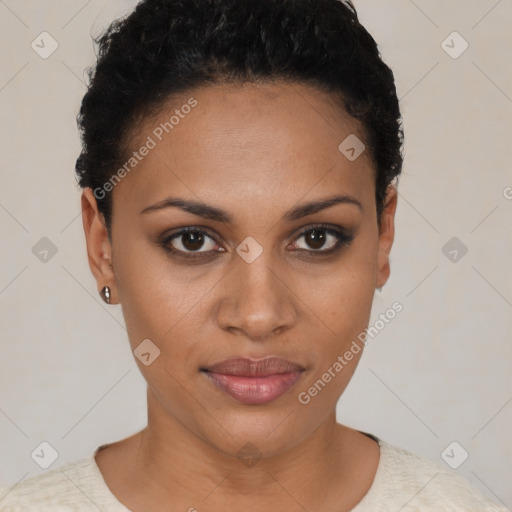 Joyful black young-adult female with short  black hair and brown eyes