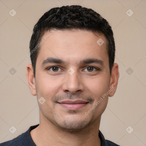 Joyful white young-adult male with short  black hair and brown eyes