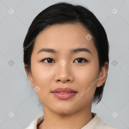 Joyful asian young-adult female with medium  black hair and brown eyes