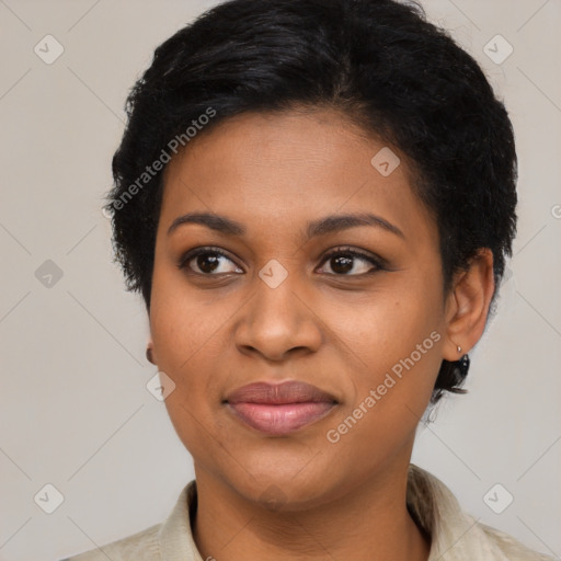 Joyful black young-adult female with short  black hair and brown eyes