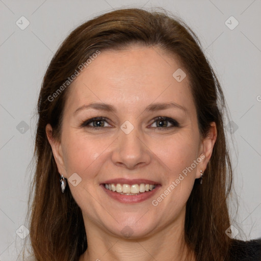 Joyful white adult female with medium  brown hair and grey eyes