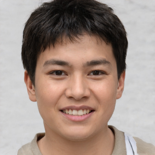 Joyful white child male with short  brown hair and brown eyes