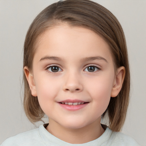 Joyful white child female with medium  brown hair and brown eyes