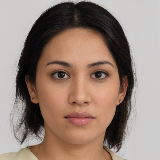 Neutral latino young-adult female with medium  brown hair and brown eyes