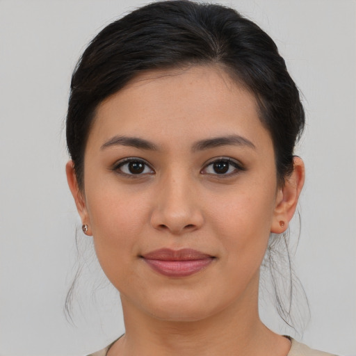 Joyful asian young-adult female with medium  brown hair and brown eyes