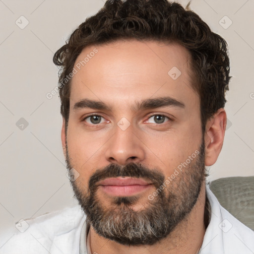 Neutral white young-adult male with short  brown hair and brown eyes