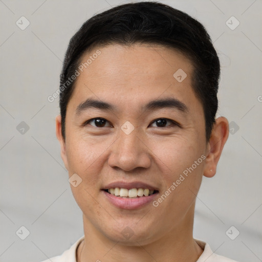 Joyful asian young-adult male with short  brown hair and brown eyes