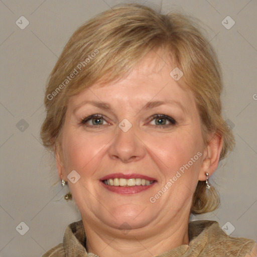 Joyful white adult female with medium  brown hair and blue eyes