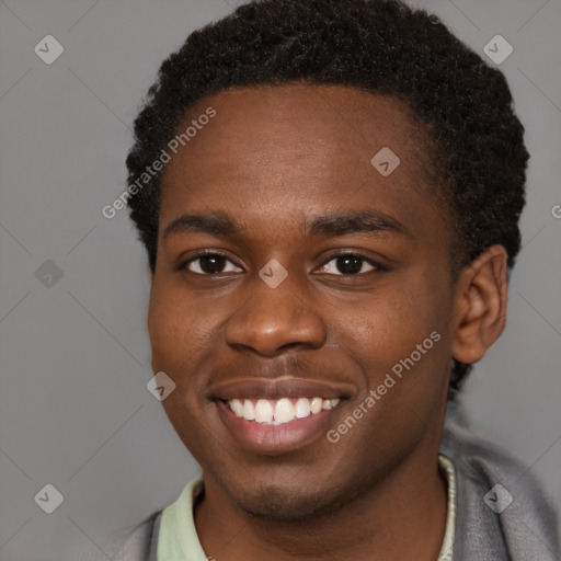 Joyful black young-adult male with short  brown hair and brown eyes