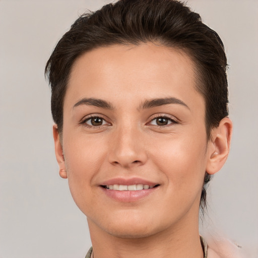 Joyful white young-adult female with short  brown hair and brown eyes