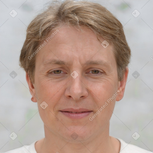 Joyful white adult female with short  brown hair and brown eyes