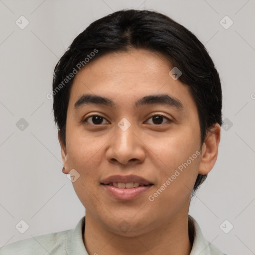 Joyful latino young-adult male with short  black hair and brown eyes