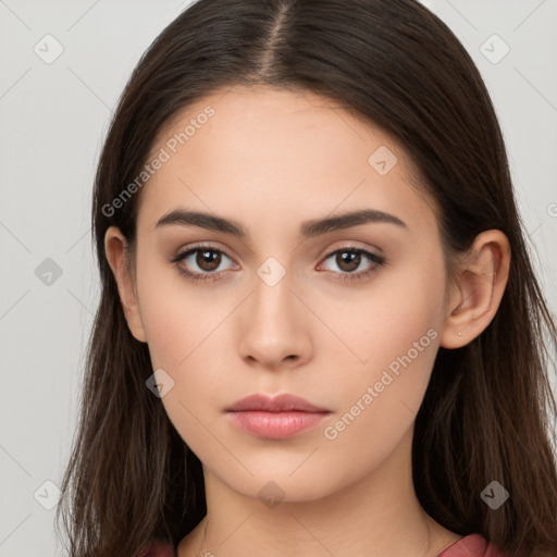 Neutral white young-adult female with long  brown hair and brown eyes