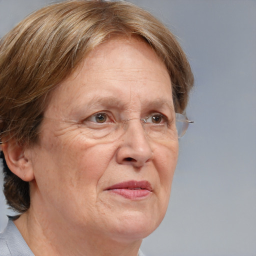 Joyful white middle-aged female with medium  brown hair and grey eyes