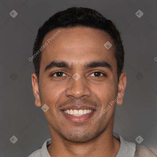 Joyful latino young-adult male with short  black hair and brown eyes