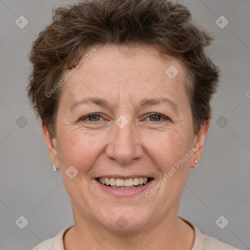 Joyful white adult female with short  brown hair and brown eyes