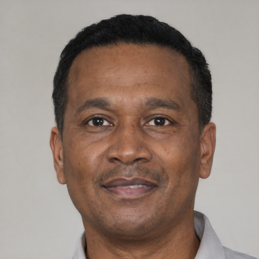 Neutral latino adult male with short  black hair and brown eyes