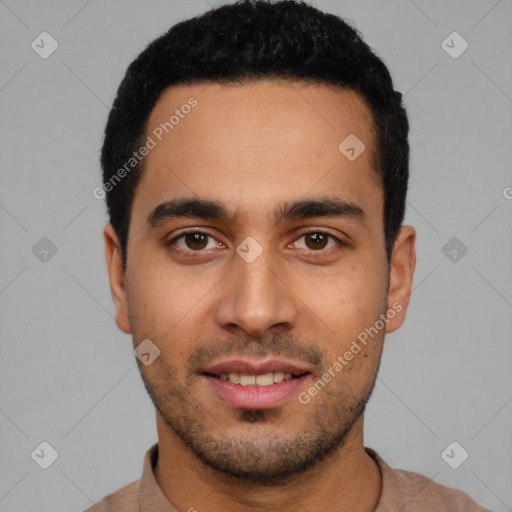 Joyful latino young-adult male with short  black hair and brown eyes