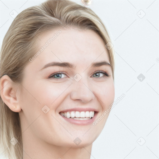 Joyful white young-adult female with long  brown hair and blue eyes