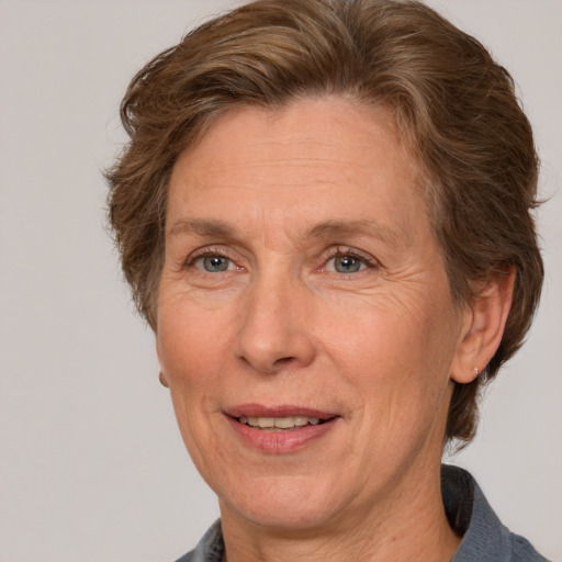 Joyful white middle-aged female with medium  brown hair and brown eyes