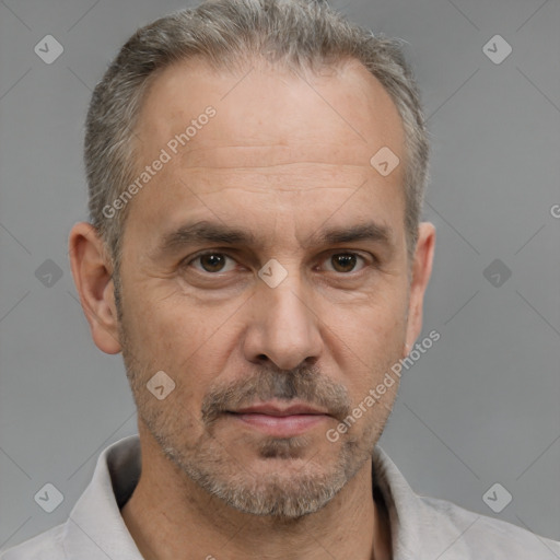 Neutral white adult male with short  gray hair and brown eyes