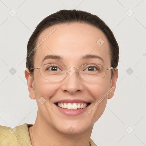 Joyful white adult female with short  brown hair and grey eyes