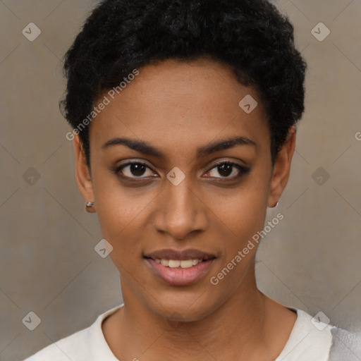 Joyful black young-adult female with short  black hair and brown eyes