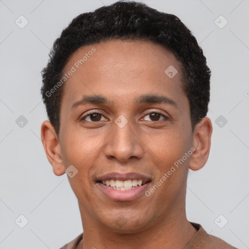 Joyful white young-adult male with short  black hair and brown eyes