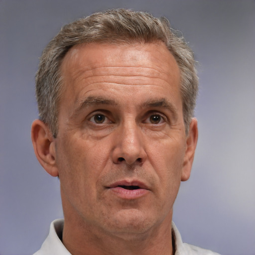 Neutral white middle-aged male with short  gray hair and brown eyes