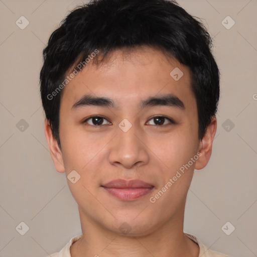 Joyful asian young-adult male with short  black hair and brown eyes