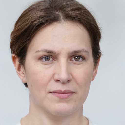 Joyful white adult female with short  brown hair and grey eyes