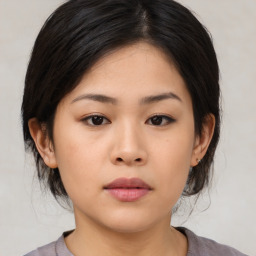 Neutral asian young-adult female with medium  brown hair and brown eyes